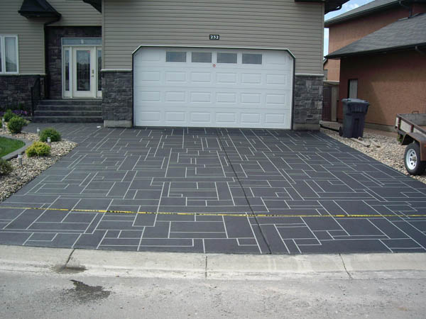 Driveway with concrete repair offers a unique look