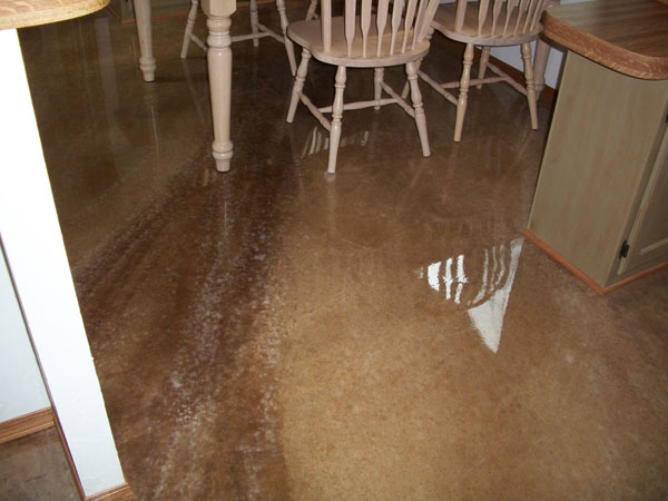 reflective floors and counters in a kitchen